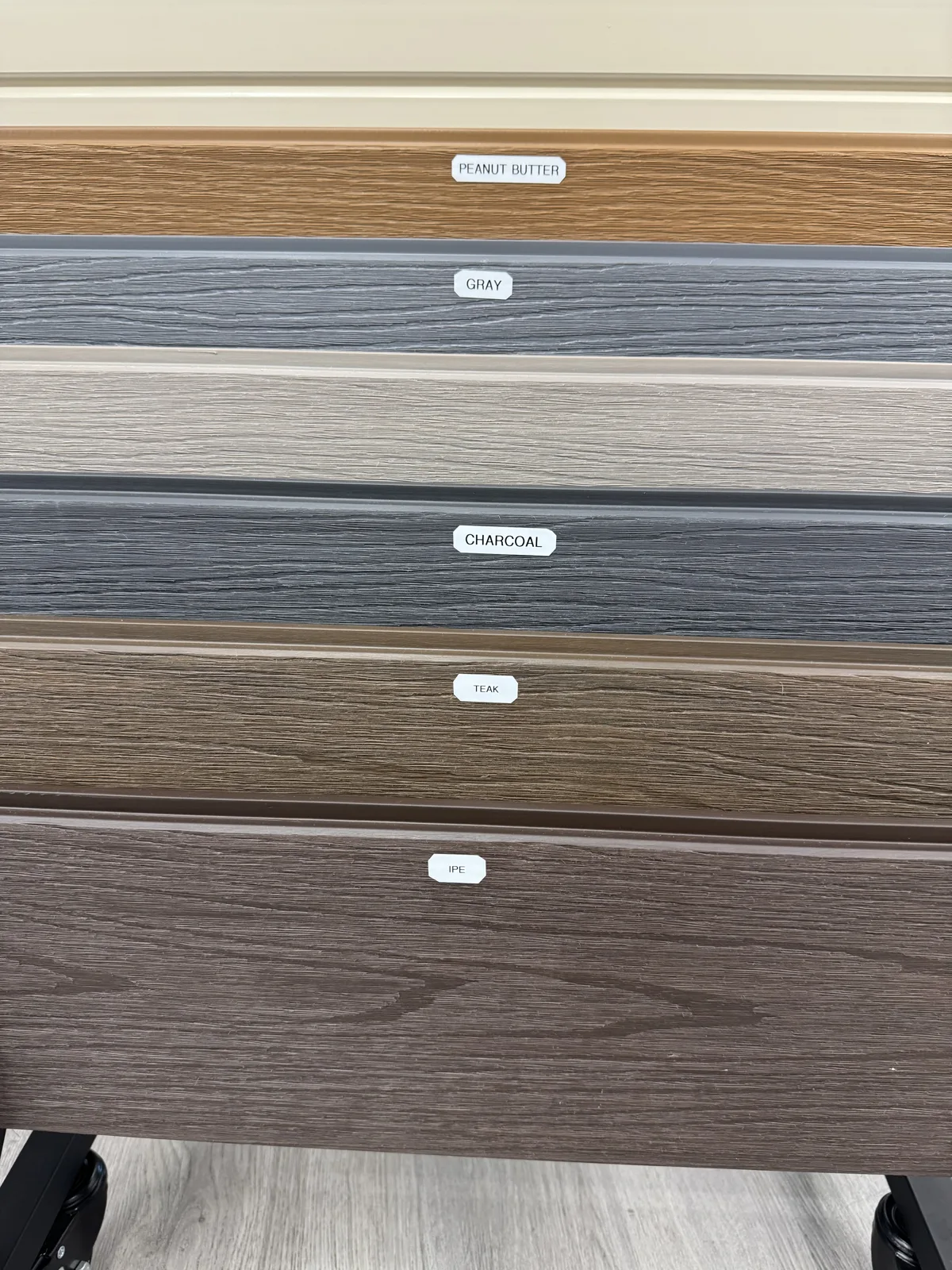 Composite colour board on the Rosemead showroom floor showing Peanut Butter, Gray, Antique, Charcoal, Teak and Ipe